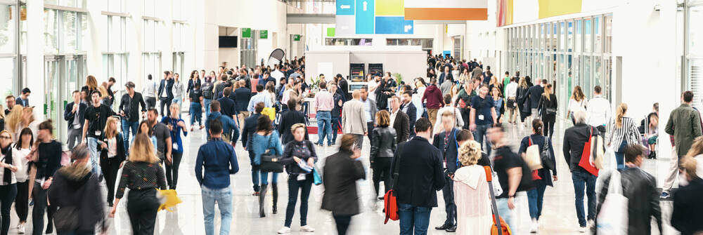 Crowd walks the floor of a tradeshow